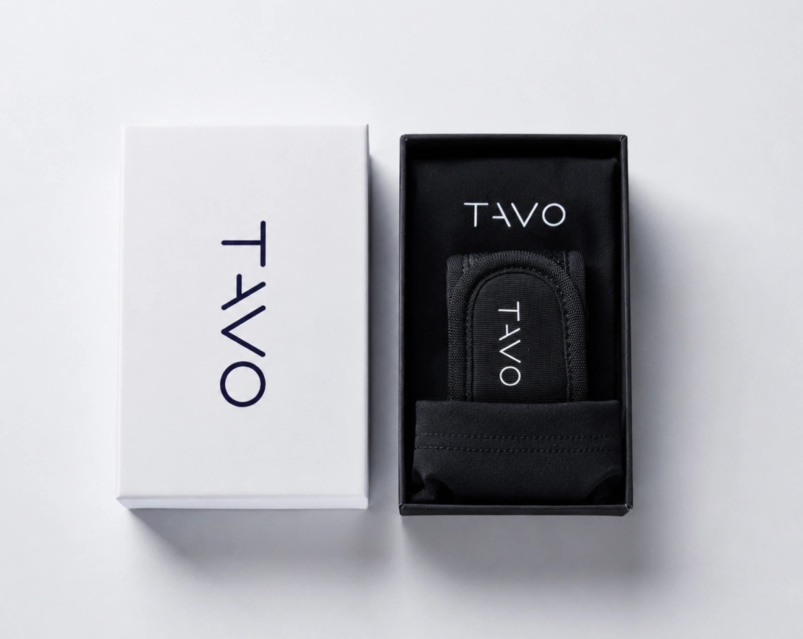 TAVO V2 black pouch in a branded box on a white background